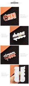 Detail of Halloween hair claw clip with orange pumpkin, BOO text and marble texture