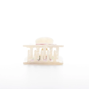 Close-up of acetic acid hair claw clip with pink floral and green leaf patterns