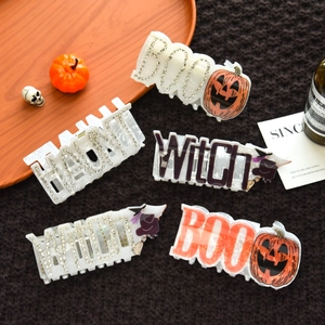Halloween claw clip set with BOO WITCH lettering, rhinestones, pumpkin and skull designs