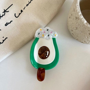 Detailed view of an avocado popsicle hair claw made of high-quality acetate material