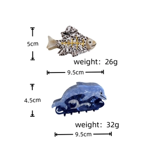 Detailed size chart for the dolphin and fish shaped acetate hair claw clips