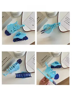 Detail view of ocean-themed jellyfish and shell hair clips with blue glitter finish