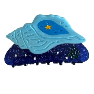 Ocean series shell hair claw clip with starfish and coral details in blue and yellow