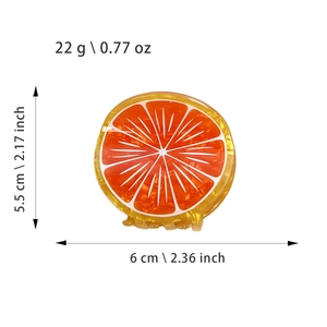 Détail de la pince à cheveux orange avec dimensions et spécifications de poids incluses