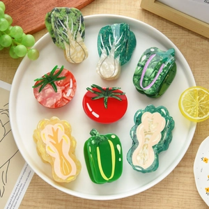 Unique vegetable shaped acetate hair claws featuring cabbage and tomato designs in a set