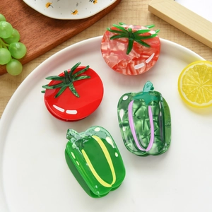 Creative vegetable acetate hair claws with tomato and green pepper designs in a dish