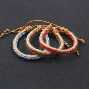 Three handmade woven hemp rope bracelets with adjustable knots and bohemian style