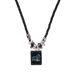 Detailed macro shot of Leo constellation pendant with black braided leather rope necklace
