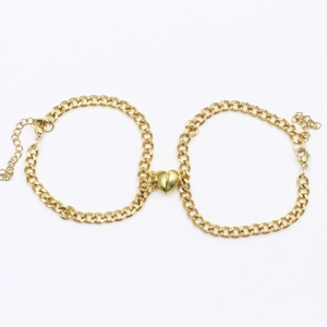 Golden heart magnetic couples bracelet set featuring a classic curb chain design