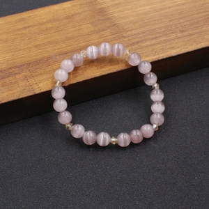 Pink cat eye stone beaded bracelet with yellow crystal accents for elegant women