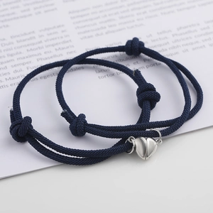 Magnetic heart couple bracelets with navy blue braided rope and adjustable knots