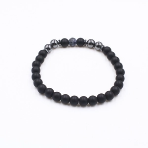 Classic beaded anklet with matte black stone, hematite beads, and blue marble accent