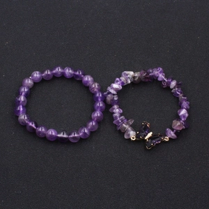 Amethyst beaded bracelet set with irregular stones and gold-trimmed butterfly charm