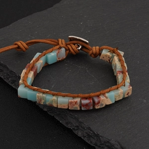 Detail view of handmade Bohemian leather wrap bracelet with natural emperor stones