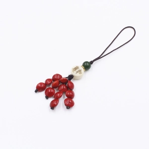 Detail of red sandalwood seed pendant with Ruyi lotus beads and auspicious calligraphy