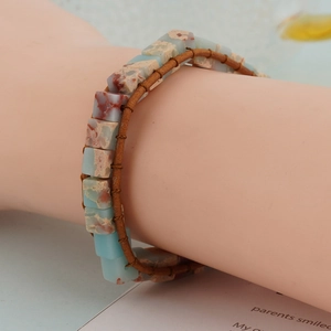 Bohemian imperial stone leather bracelet featuring blue and brown woven gemstones
