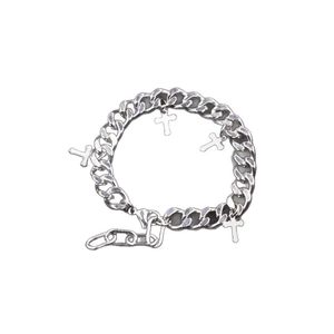 Silver Cuban chain bracelet with four cross pendants and adjustable lobster clasp closure
