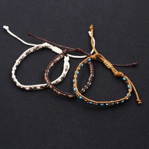 Three-piece bohemian braided rope bracelets with turquoise beads and adjustable knots