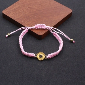 Handmade woven pink sunflower daisy friendship bracelet with adjustable wax cord