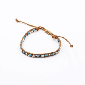Ethnic bohemian braided rope bracelet with turquoise beads and retro silver metal charms
