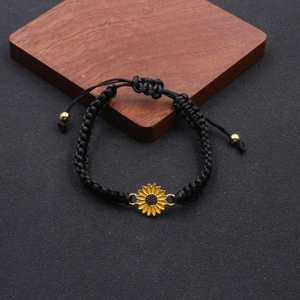 Handmade woven sunflower charm bracelet with adjustable black string and golden beads