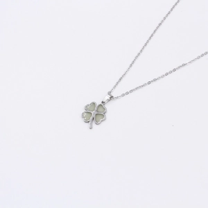 Luminous four-leaf clover pendant necklace in minimalist silver-tone design for women