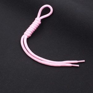 Detailed view of pink woven nylon cord with knotted loop and heat-sealed ends