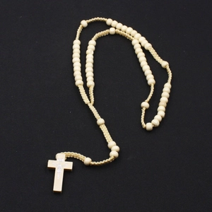 Classic 8mm wooden rosary necklace with carved cross pendant on black background