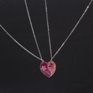 Sparkly glitter heart-shaped best friends pendant necklaces with floral butterfly detail