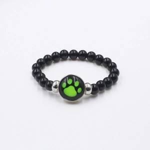 Cartoon ladybug bear paw print beaded bracelet with black polished beads and green charm