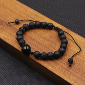 Pulsera artesanal de piedra volcánica negra de 12mm con cordón trenzado negro ajustable