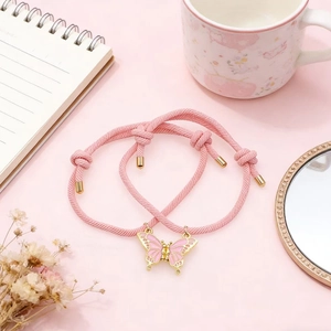 Pulseras de mariposa rosa con cuerda tejida y corazón magnético para parejas