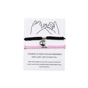 Handmade magnetic heart-shaped friendship bracelets for couples on a message card