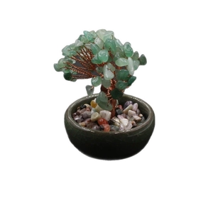 Handmade green crystal money tree with copper wire branches in a dark green ceramic pot