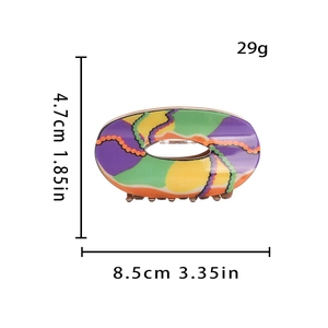 Colorful acetate hair claw clip with abstract pattern and product dimensions 8.5cm x 4.7cm