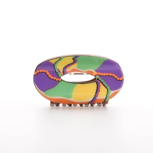 Colorful oval claw clip with abstract purple and green wave patterns for women