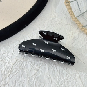 Glossy black acetate hair claw clip featuring white Scottie dog pattern for women