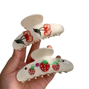 Elegant cherry and strawberry claw hair clips set with crystals on beige acetate base