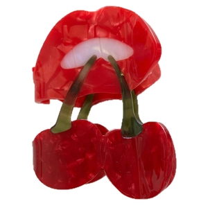 Red lip and cherry acetate hair claw clip with marble texture for elegant updos