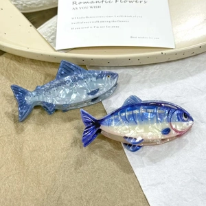 Creative fish shaped hair claw clips made of marbled acetate in blue and white patterns
