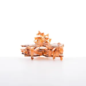 Detail of maple leaf hair claw with amber marble texture and small rhinestones