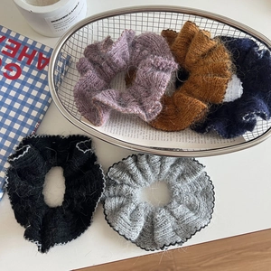 Chic knit hair scrunchies set in five colors displayed in a stylish metal basket