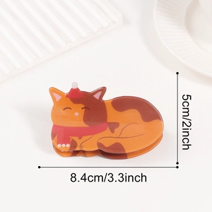 Detail view of cat hair claw clip with red scarf and hat showing 8.4cm length dimension