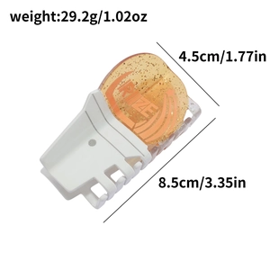 Creative acetate shark hair claw clip in orange and white with size and weight details
