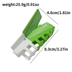 Detail showing dimensions and 25.9g weight of green striped acetate hair claw clip