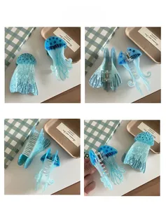 Detail view showing blue jellyfish hair claw clip with internal spring and teeth