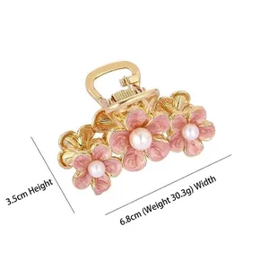 Elegant golden alloy flower hair claw clip with pink enamel petals and pearls