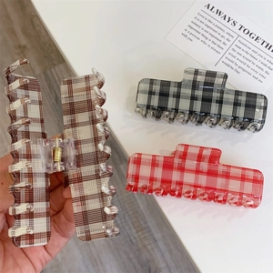 Large vintage plaid acetate hair claw clips in brown, black and red patterns