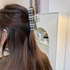 Large vintage plaid hair claw clip for thick hair shown in a stylish half-up hairstyle