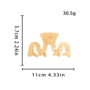 Tableau des tailles d'une grande pince à cheveux marbrée orange de 11cm de large et 5,7cm